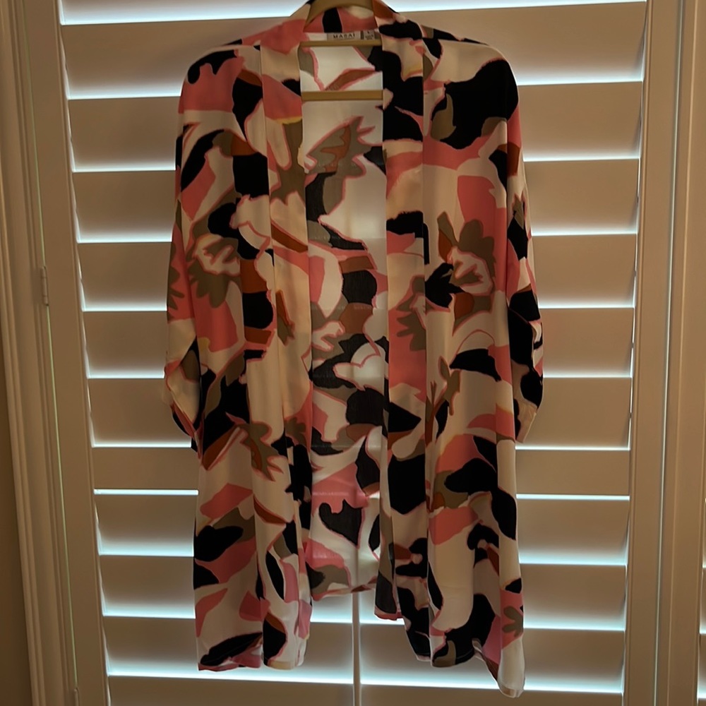 Loose fitting multicolor jacket. Great over top.